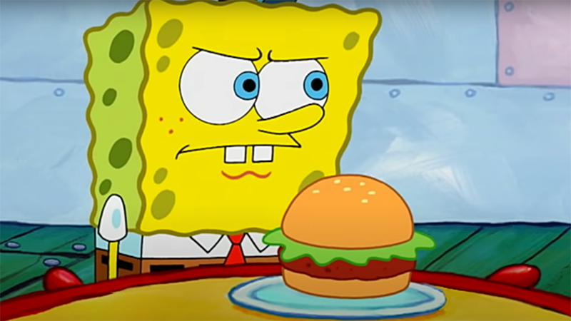 SpongeBob stands guard over a Krabby Patty