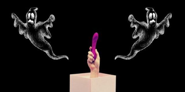 A hand on a box holds a sex you in front of a black background with spooky ghosts floating