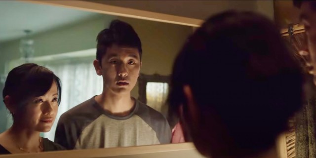 In Alice Wu's new Oreo commercial, a short Chinese woman looks at her tall son, who is also Chinese, in the mirror. The color tones are muted. The son looks surprised while the mother has a sly smile.
