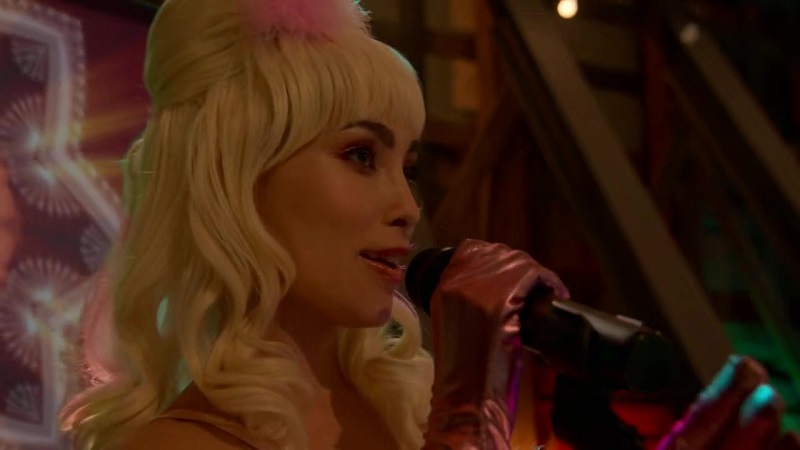 Dressed as one of the Fembots from Austin Powers, Isabella performs karaoke.
