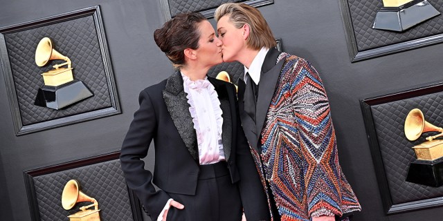 Catherine Shepherd and Brandi Carlile kissing on the red carpet