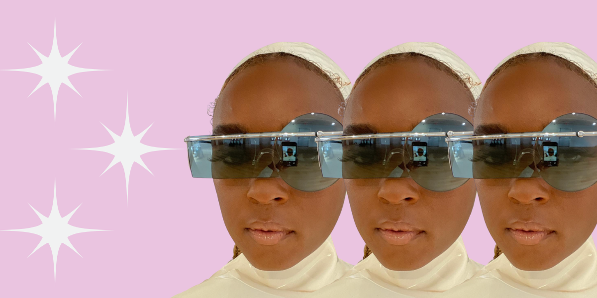Janelle Monáe wears futuristic sunglasses while taking a selfie