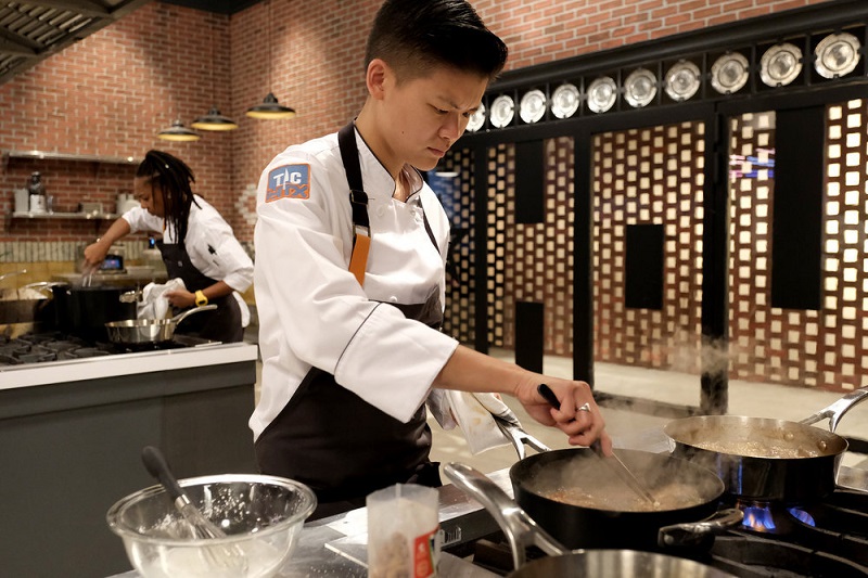 Jo stirs the ingredients in her pan while participating in this week's challenge.