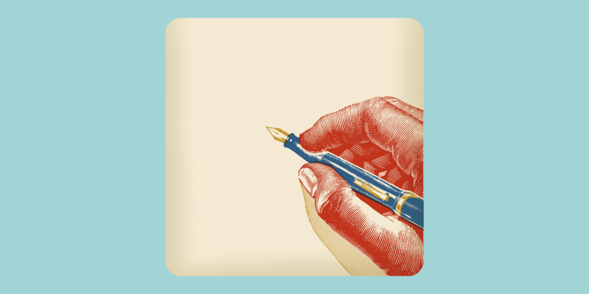 A hand holding a pen against a blue background