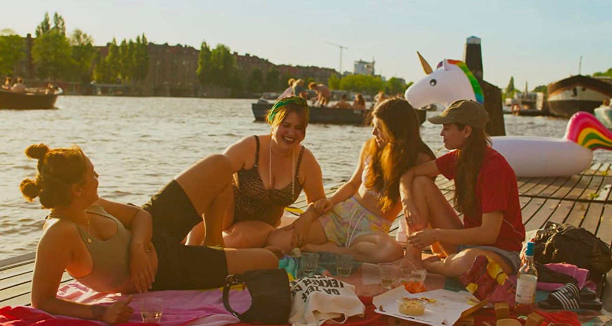 Anne and her friends on a dock