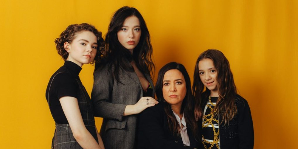 the cast of better things against a gold backdrop