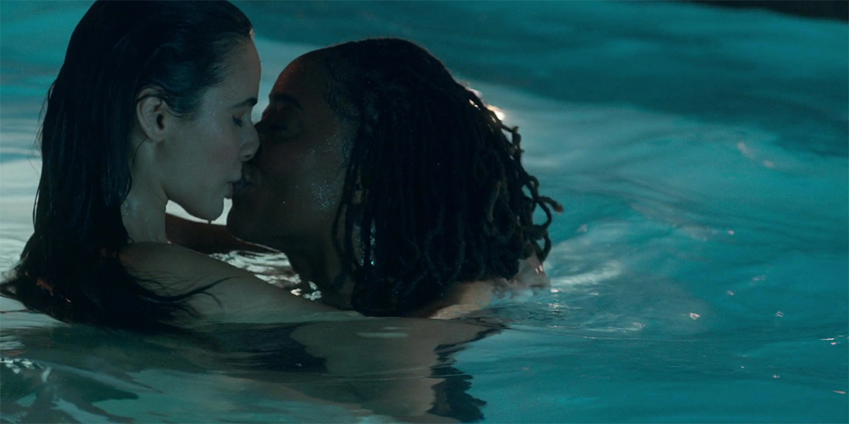 Malika and Angelica share a kiss in the Coterie pool.