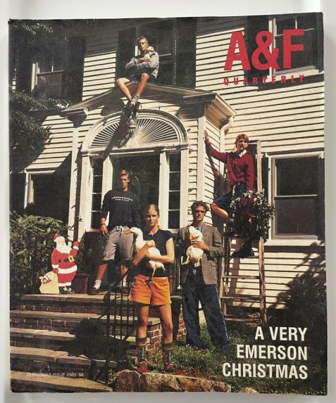 "A Very Emerson Christmas" cover of A&F Quarterly, featuring a white thin family in their early 20s in Abercrombie gear standing outside a white house