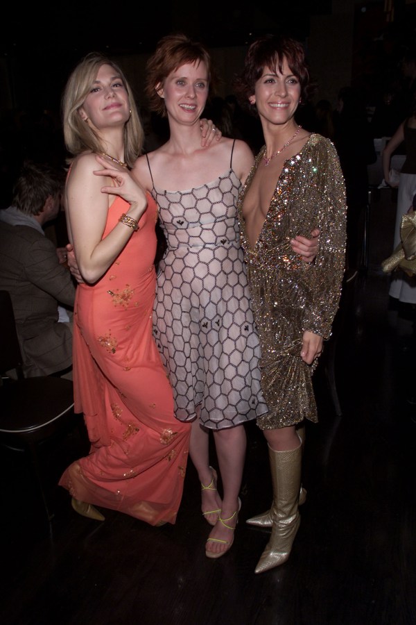 Thea Gill, (left) and Michelle Clunie, stars of Showtime Network's 'Queer As Folk' flank guest, Cynthia Nixon of HBO's 'Sex in the City' at a world premiere screening of the controversial program last night in New York City. The series is a brave, realistic, and funny portrayal of the lives of a group of gay men and lesbians debuting on Showtime on December 3. (credit Nick Elgar/ImageDirect)