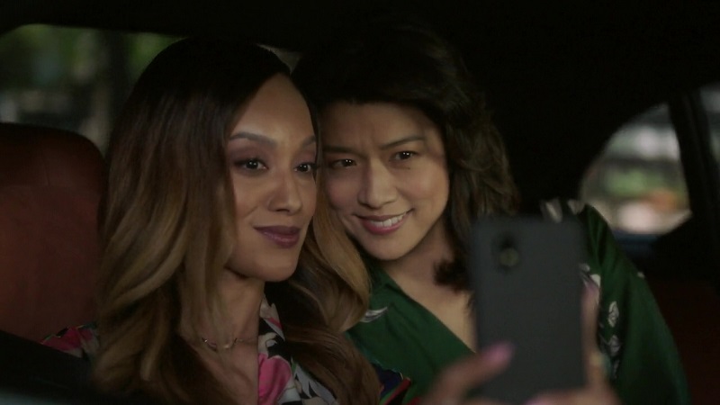 Shanice and Katherine take a selfie together in the backseat of their ride to the airport.