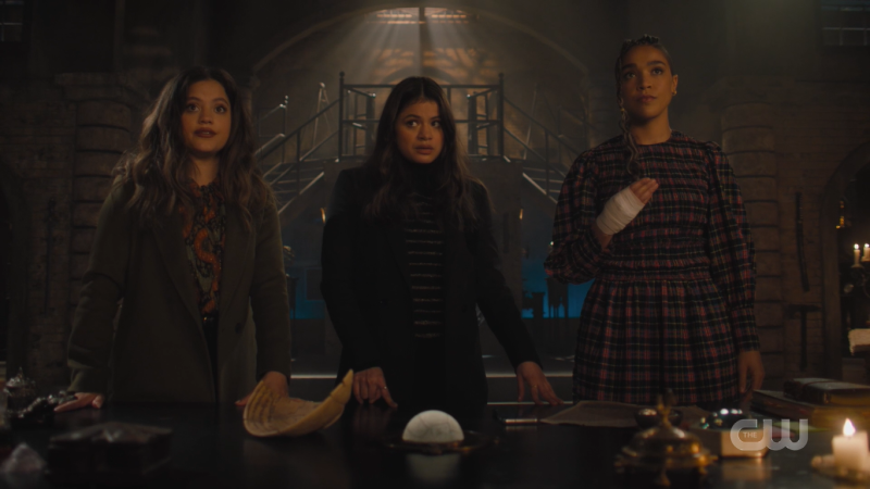 Charmed: Maggie, Mel and Kaela stand in front of the witch board in their bunker
