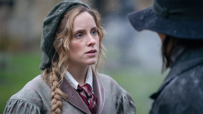 Gentleman Jack: Ann Walker in a braid stands in the snow looking at Anne