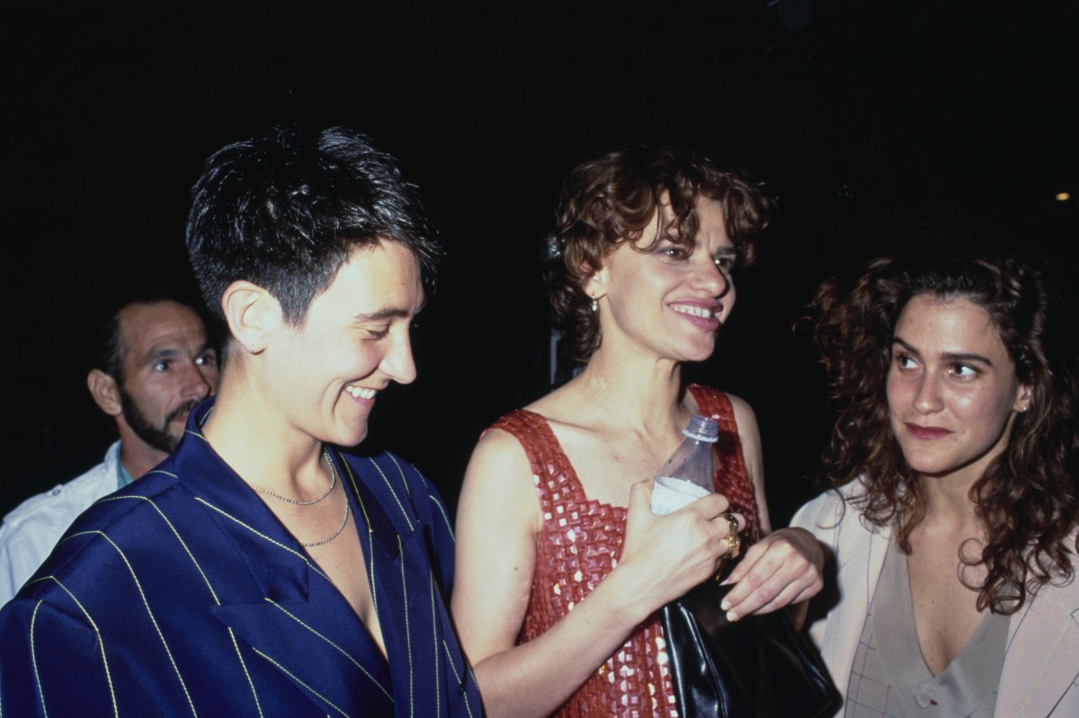 Canadian singer-songwriter kd lang, wearing a pinstripe blue jacket, and American actress and comedian Sandra Bernhard, wearing a red minidress, and American singer-songwriter and guitarist Wendy Melvoin attend the Los Angeles premiere of 'Truth or Dare' held at the Pacific Cinerama Dome in Los Angeles, California, 6th May 1991. (Photo by Vinnie Zuffante/Michael Ochs Archives/Getty Images)