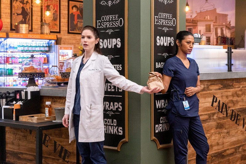 Standing on opposite sides of the pillar near the hospital's coffee shop, Leyla passes over her latest installment to Lauren in a brown paper bag.