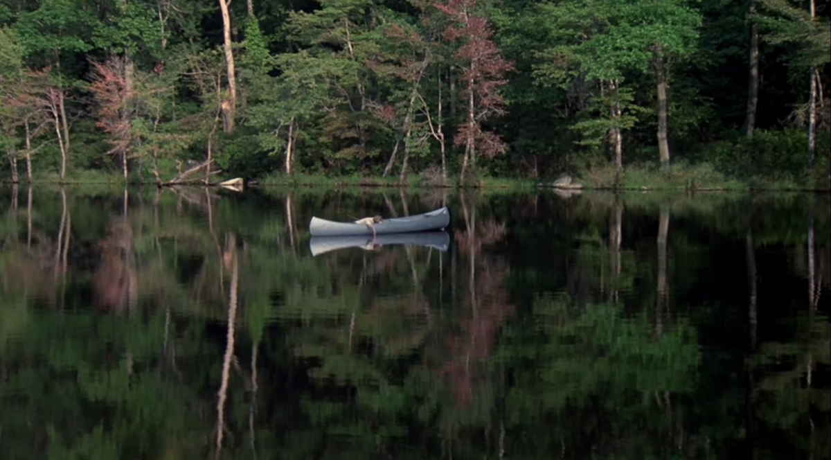 Alice in a canoe in the middle of the lake in Friday the 13th