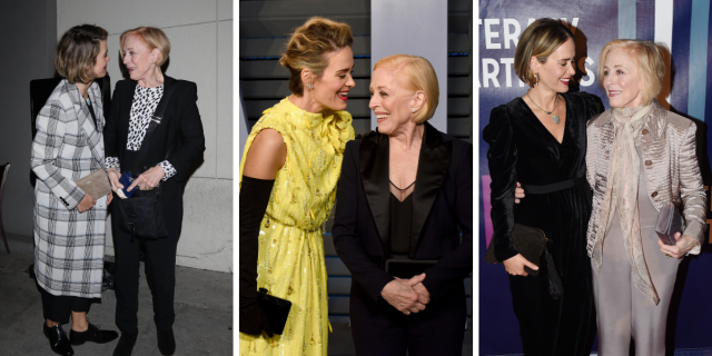 Photo 1: Sarah Paulson and Holland Taylor stand while looking in each other's eyes. Sarah is wearing a long plaid wool coat, and Holland is wearing a black suit with a black and white spotted blouse. Photo 2: Sarah Paulson stands with Holland Taylor, looking at her and smiling. Sarah wears black elbow-length gloves and a yellow evening dress. Holland wears a black suit. Photo 3: Sarah Paulson and Holland Taylor stand with their arms around each other. Sarah is giving Holland googly eyes. Sarah wears a black dress with a v-neckline, and Holland wears a taupe suit.