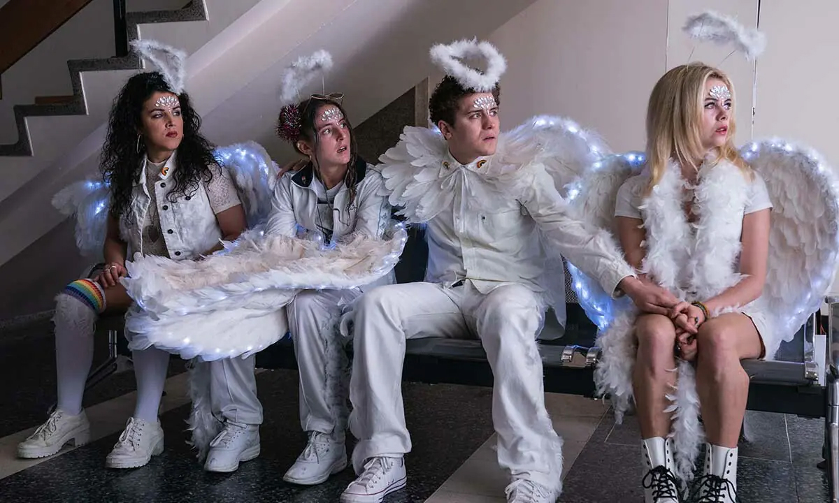 Michelle, Orla, Erin, and James are dressed as angels in the hospital