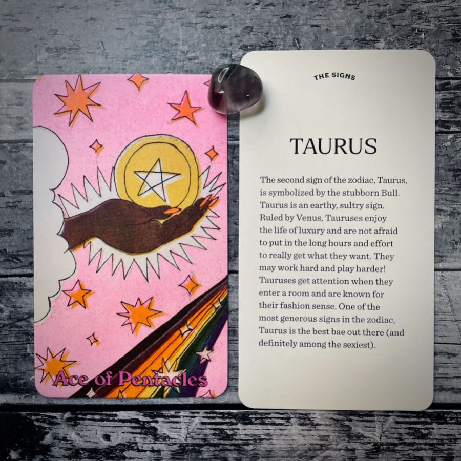 In two tarot cards on a grey background:  Left: A black hand with long orange nails is holding a gold pentacle. It is in front of a pink background with orange stars. And a white fluffy cloud. Right: Taurus