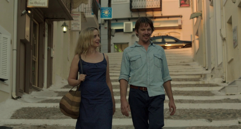 Julie Delpy and Ethan Hawke walk down steps in Athens