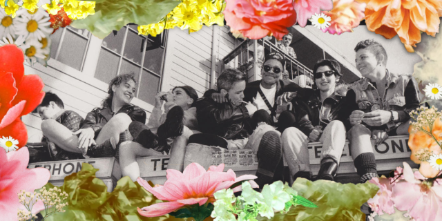 A black and white photo shows seven smiling queer women sitting on top of telephone booths. Three people stand below them. Two others are visible on a balcony behind them. The image is surrounded by a border of pink, orange, green and yellow flowers.