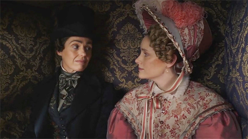 Anne Lister and Ann Walker look affectionately at each other in the carriage