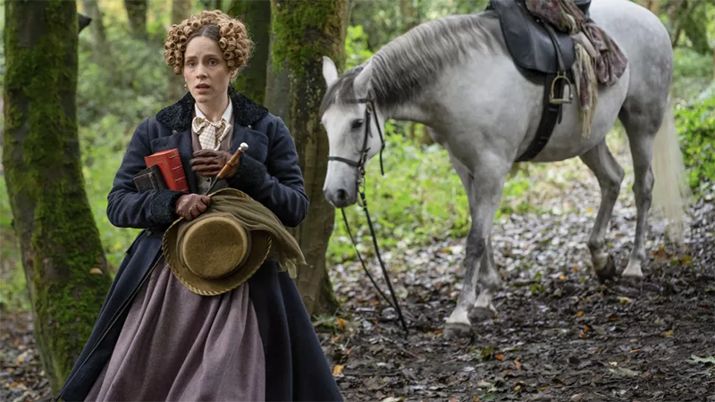 Gentleman Jack: Ann Walker stands in the woods in front of her horse