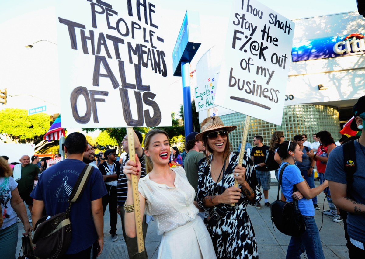 LOS ANGELES, CA - AUGUST 19: Actress Amber Heard (L) holds a protest sign with her girlfriend Tasya Van Ree (R) during a same-sex marriage advocates demonstration against the stay barring gay marriages on August 19, 2010 in Los Angeles, California. On August 4, District Judge Vaughn Walker ruled against Proposition 8 as unconstitutional, and after his ruling the U.S. Ninth Circuit Court of Appeals granted proponents of Proposition 8 a stay on August 16. (Photo by Kevork Djansezian/Getty Images)