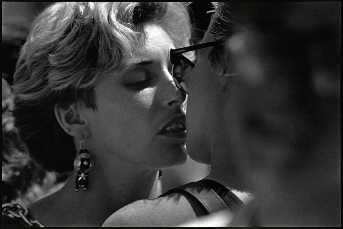 Two women are about to kiss in a close up black and white photo