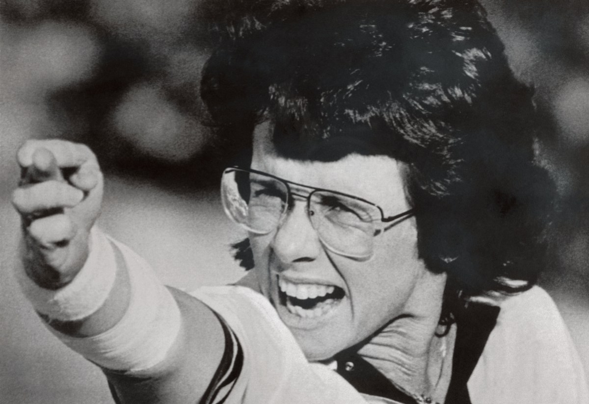Billie Jean King gives a heckler the middle finger (it's sideways, but still the point gets across) after a match. The photo is in black and white.