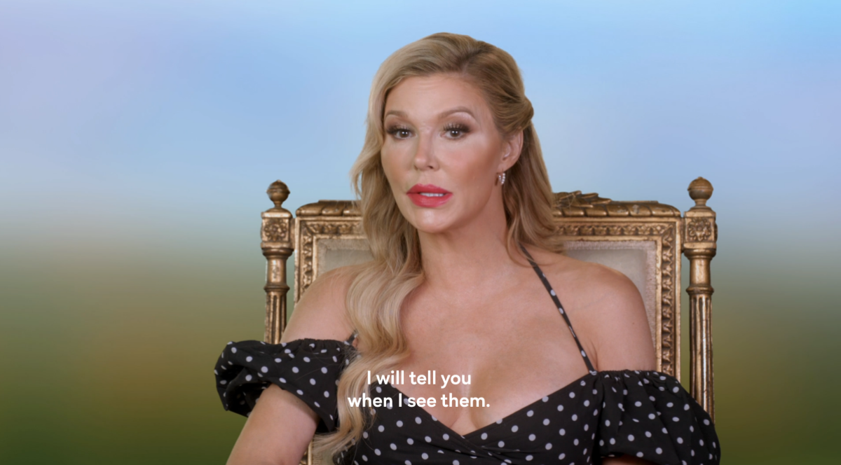 Brandi Glanville, a white woman wearing a black and white polka dot dress" says "I will tell you when I see them" on Ultimate Girls Trip.