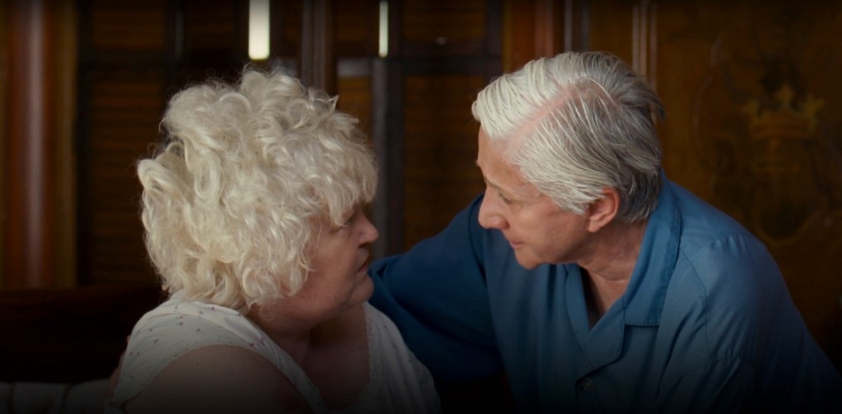 Two elderly dykes looking at each other in love