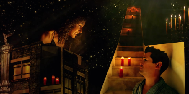 A screenshot from The Foundation for AIDS Research's "Scenes from Angels in America" fundraiser. Vella Lovell as Harper is superimposed above Andrew Rannells as Prior. The backdrop is a mix of a starry sky over a building and a staircase with candles leading from the bottom of the frame to the top. Lovell wears a black nightie and Rannells wears a turquoise robe and makeup.