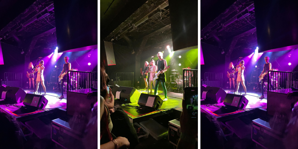 Photo 1: Bikini Kill performs on stage with purple lighting. Photo 2: Bikini Kill performs on stage with green lighting. Photo 3: Bikini Kill performs on stage with purple lighting.