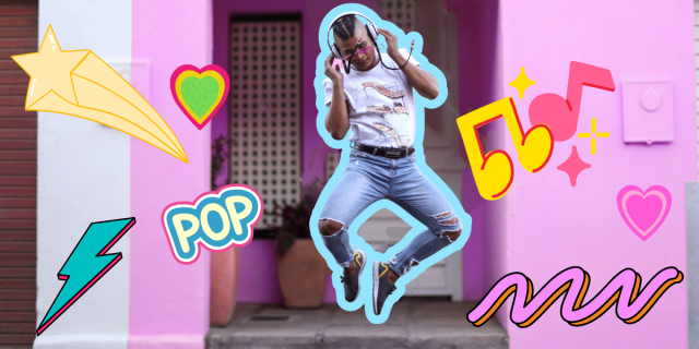 A black queer trans person in tight blue jeans, a white t shirt, and long braids listens to music in front of a pink house, around them are exaggerated 90s and 00s emojis in bright colors: a shooting star, a lightening bolt, the word "pop," music notes, and multiple hearts. The person is outlines in thick electric blue, matching the brightly colored emojis.