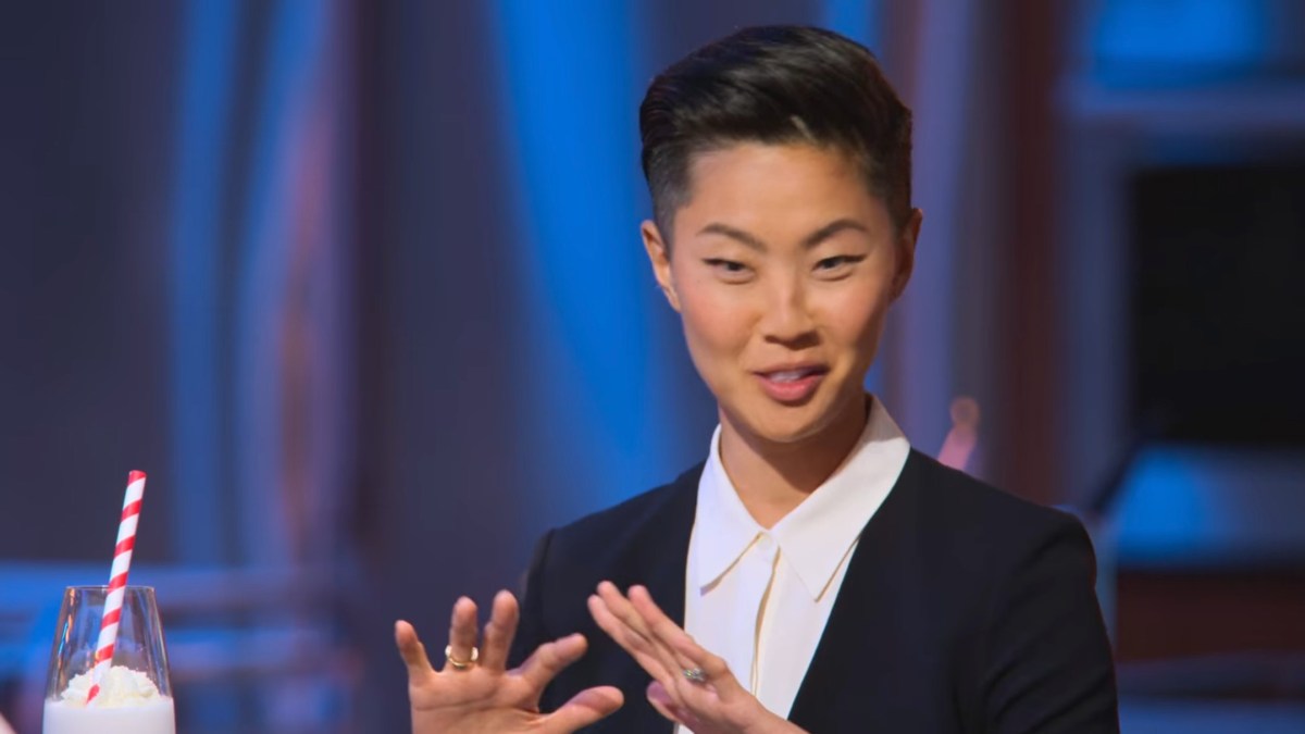 Kristen Kish in a cardigan and white button up