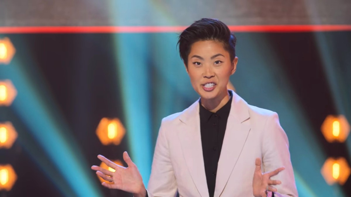 Kristen Kish in a white suit with a black button up