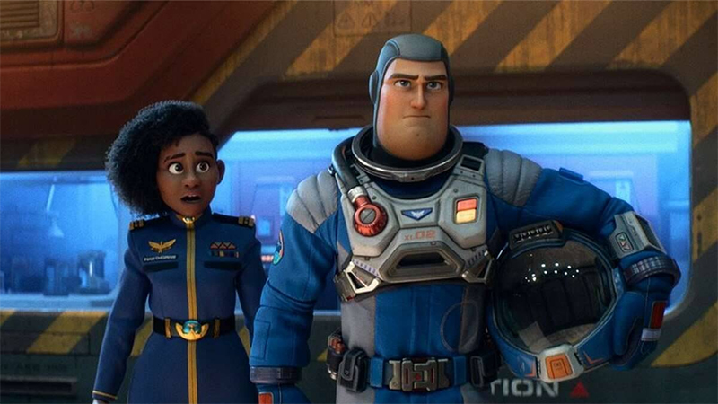 Alisha and Buzz stand together in the command center in Lightyear