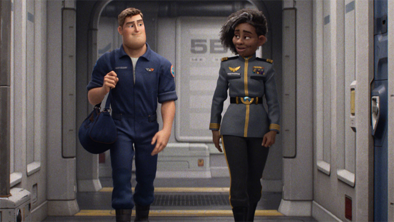 Buzz and Alisha walk together in their space suits