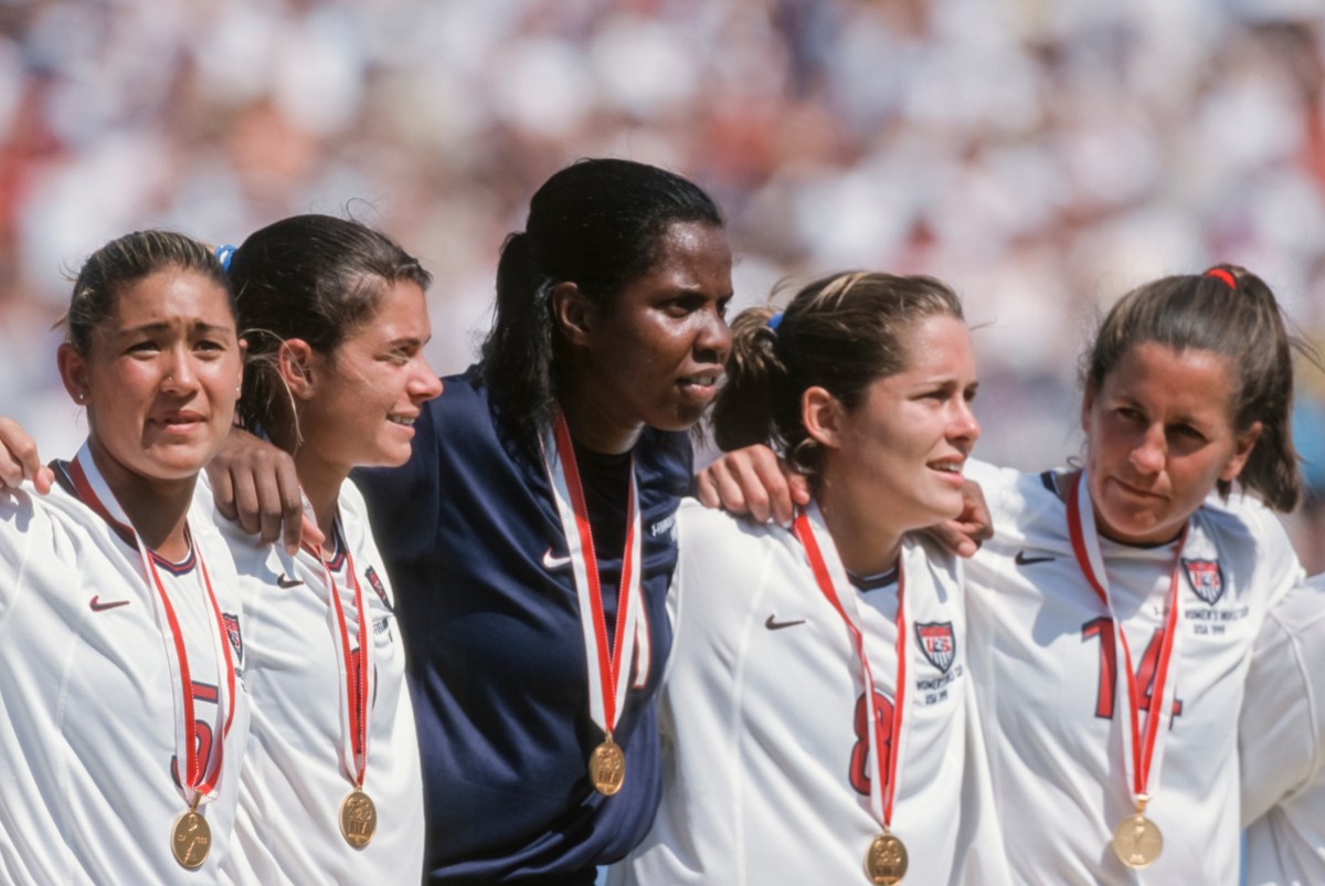 ULY 10: Tiffany Roberts #5, Mia Hamm #9, Briana Scurry #1, Shannon MacMillan #8, and Joy Fawcett #14 of the USA celebrate winning the 1999 FIFA Women's World Cup final played against China on July 10, 1999 at the Rose Bowl in Pasadena, California.