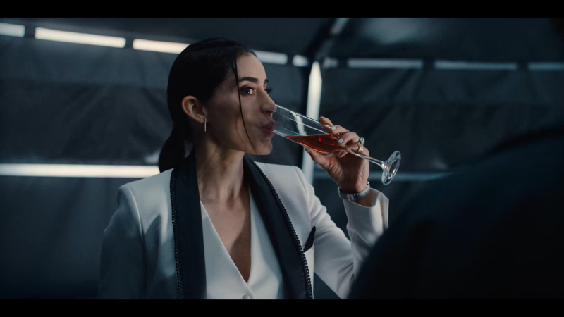 Resident Evil's lesbian CEO Evelyn Marcus takes a sip of champagne 