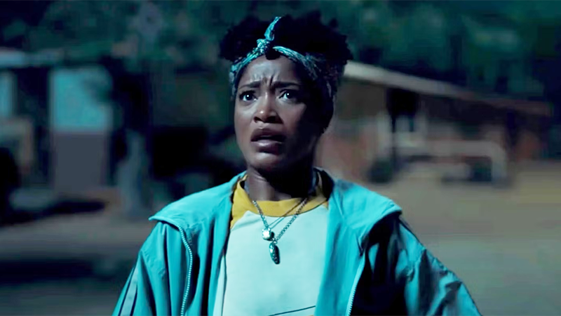Queer horror to stream: Nope. Keke Palmer stands outside at night, looking at the sky with concern
