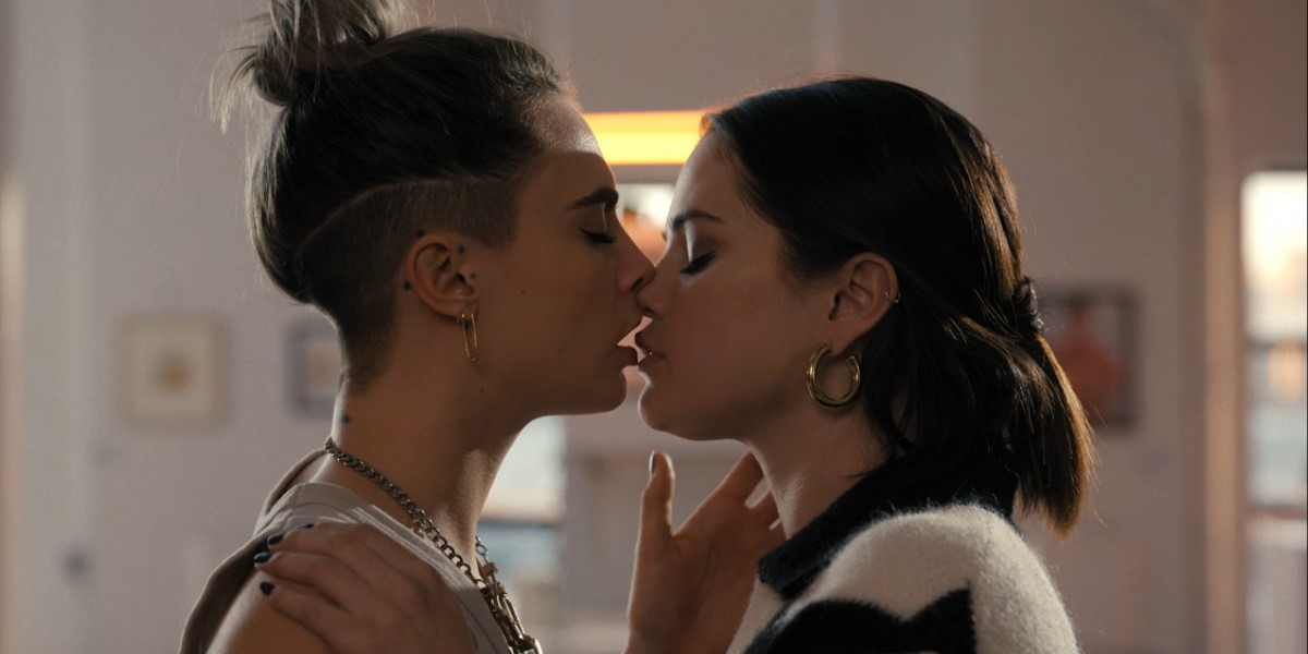 Only Murders in the Building: Selena Gomez and Cara Delevingne aka Mabel and Alice are mid-kiss, lips slightly parted