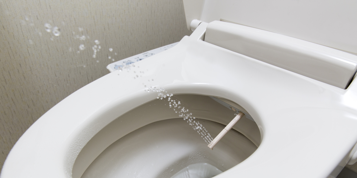 a bidet with water shooting up out of it