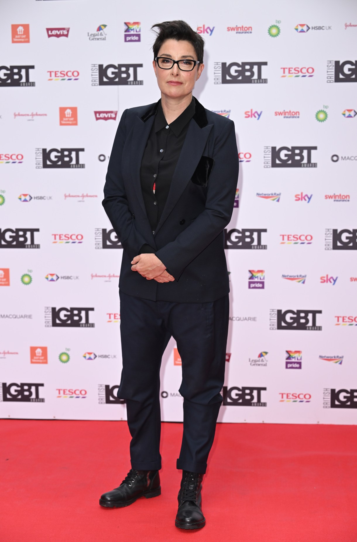 Sue Perkins in a navy blue suit