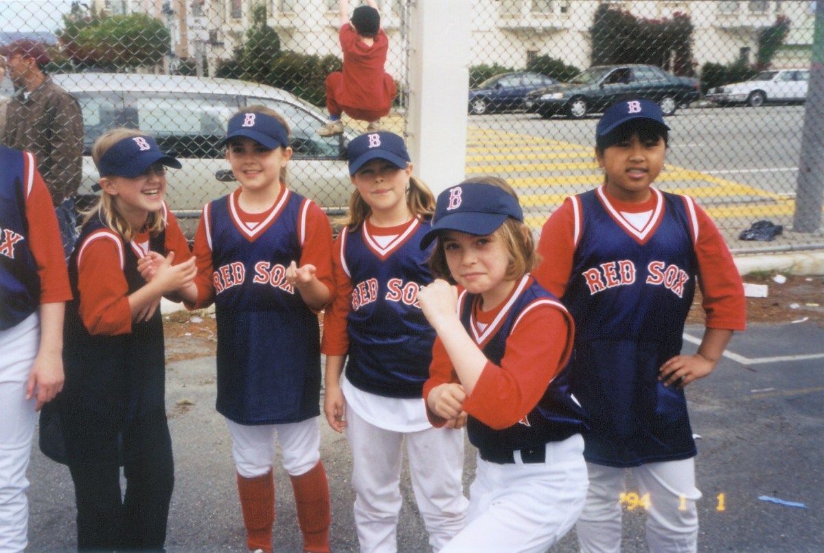 A group of young kids in Red Sox uniforms, including Autostraddle's Anya Richkind