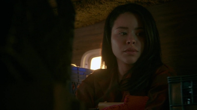 Mariana looks nervous as she rides in the back of the van to the cult farm.