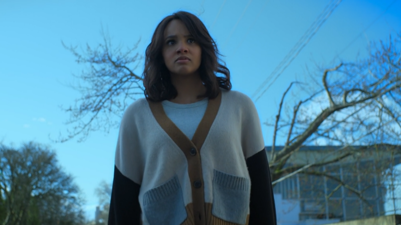 Abigail stands atop a car and looks stern as she gives her orders.