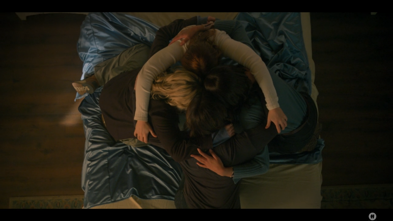 Overhead shot of the four girls putting their heads in for a group head