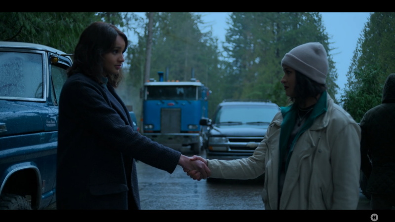 Abigail and Thelma Bearkiller shake hands