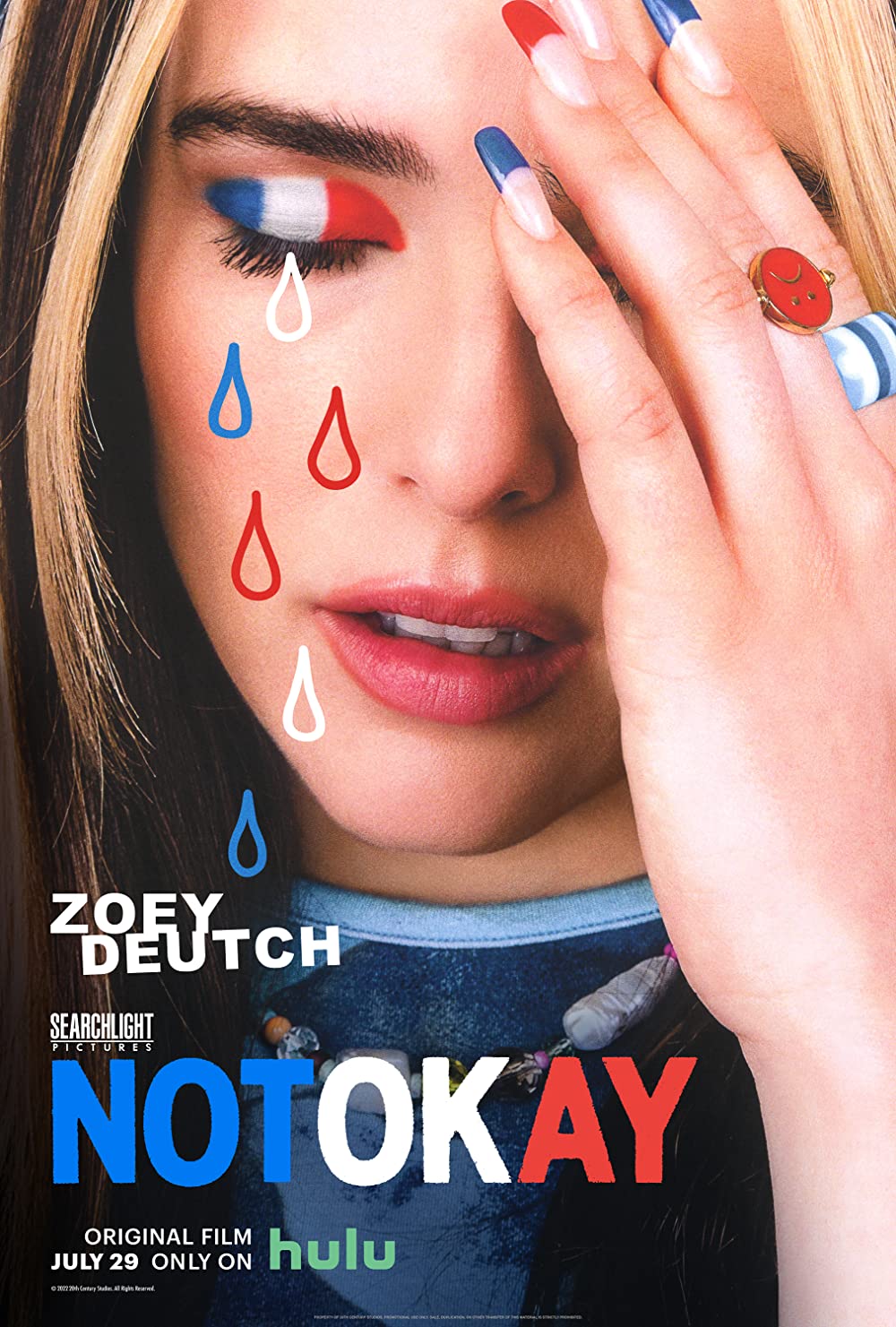 the image for not okay shows a white woman putting her hand to her face and crying illustrated red white and blue tears from an eye with a french flag on it in eye shadow